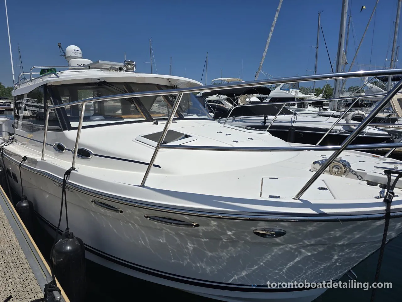 Cruiser with a fresh gloss at a Toronto marina, detailed by Toronto Boat Detailing