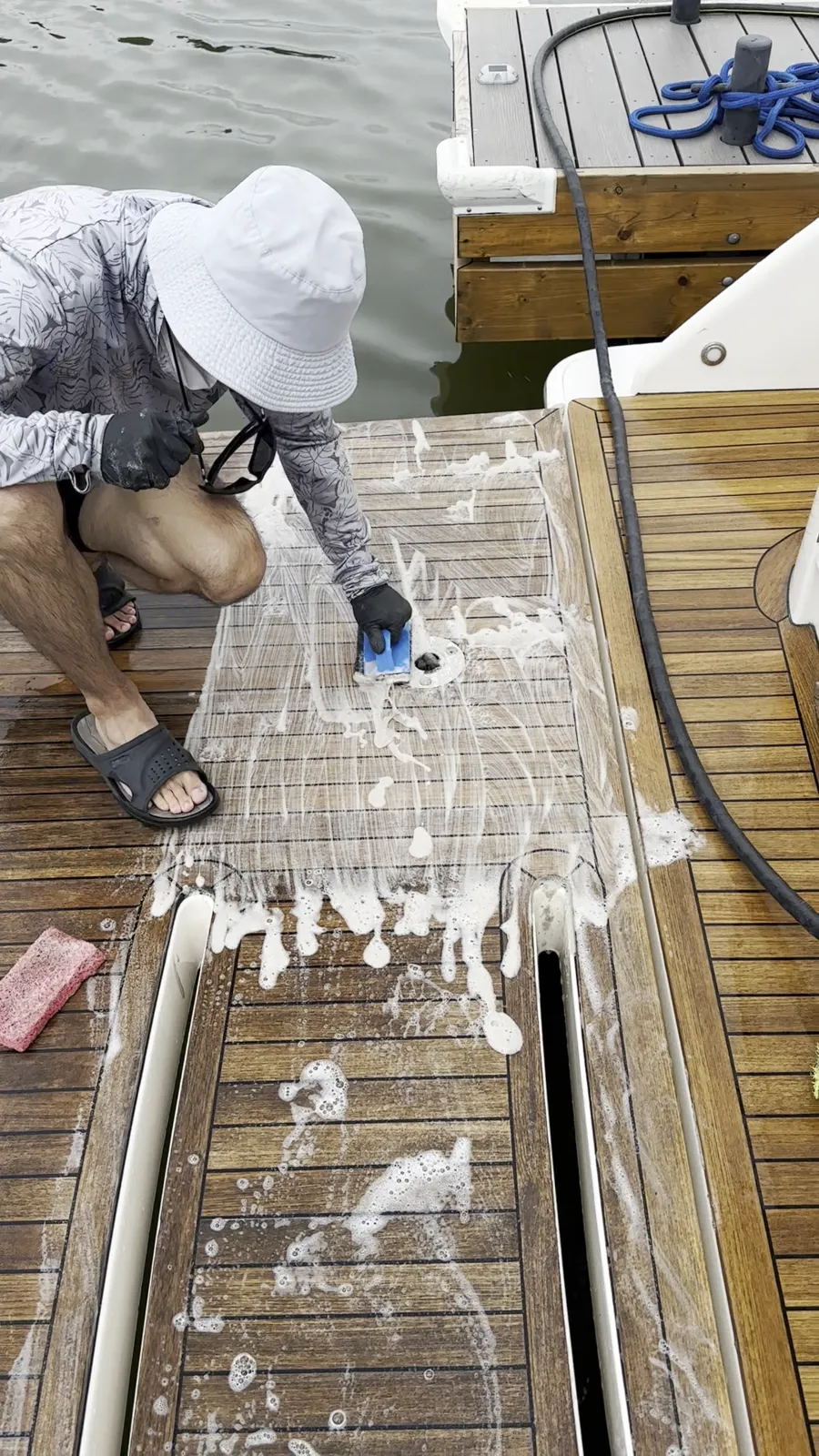 Teak swim platform being cleaned by Toronto Boat Detailing